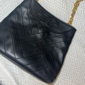 Tory Burch Lamb skin black leather handbag used few times, minor tarnished chain